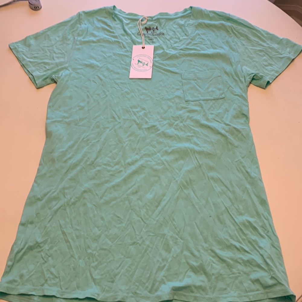 Coastal cotton life uninhabited. Woman’s V neck tee
